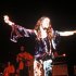 Janis Joplin performing in tie dyed velvet